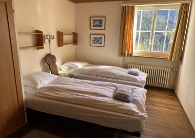 Sunny bedroom with twin beds and big window