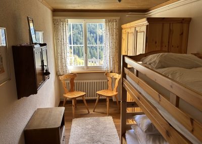 Bedroom with wooden furniture and bunk beds