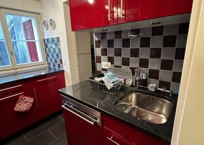 Kitchen with red cabinets