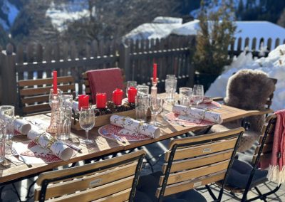 Terrace with laid out table on a sunny winter day